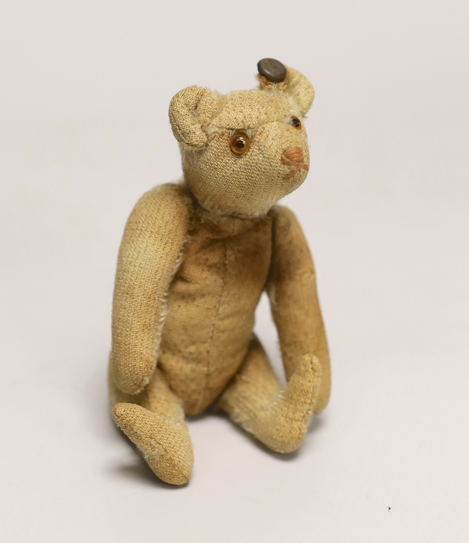 A Steiff rattle bear, with button, c.1920's, 5in., some hair loss